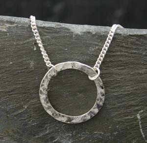 Silver round washer type hammered effect pendant